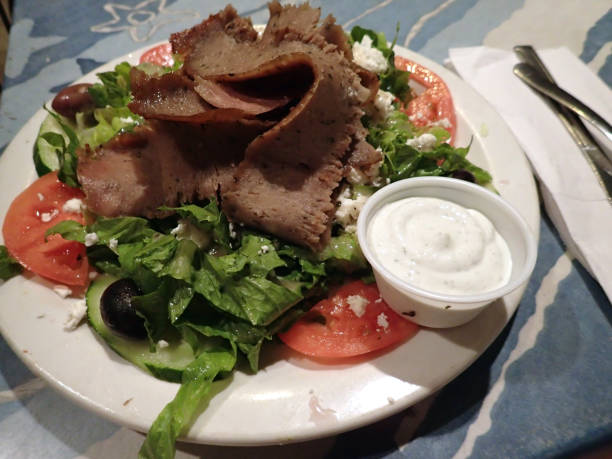 Gyro Salad with Hot slices of beef and lamp stock photo
