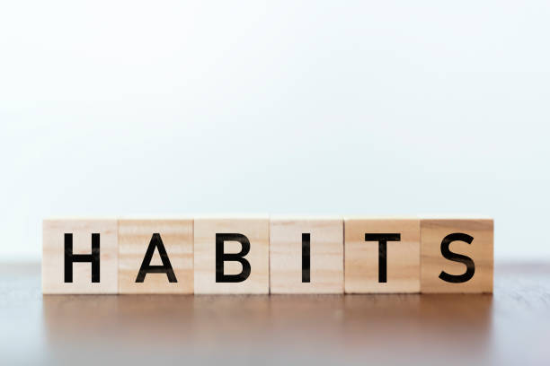habits word written on wooden cubes - change habits imagens e fotografias de stock