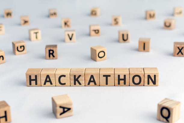 Hackathon - word from wooden blocks with letters Hackathon - word from wooden blocks with letters, hackathon  hack day, hackfest or codefest event concept, random letters around, white  background hackathon stock pictures, royalty-free photos & images
