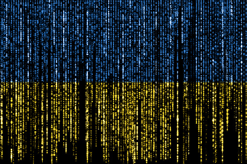 Flag of Ukraine on a computer binary codes falling from the top and fading away.