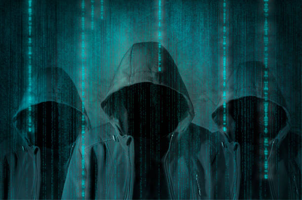 Hacker Group of hackers at work with graphic user interface around conspiracy stock pictures, royalty-free photos & images