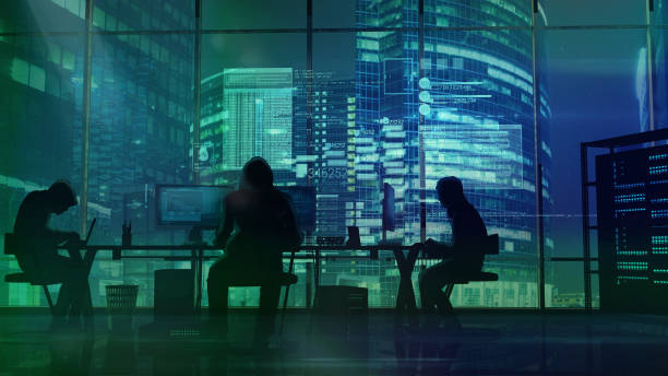 Hackers at work on the background of green office buildings stock photo
