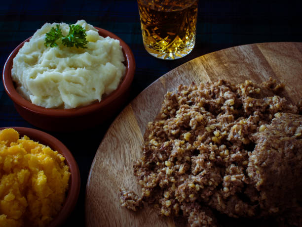 Haggis, with mashed potatoes, mashed swede and a wee dram of Scotch whiskey. Burns Night, Scotland Cooked haggis supper prepared for Burns night, a Burns supper, celebration the birthday of the Scottish poet Robert Burns on 25 January liver offal photos stock pictures, royalty-free photos & images