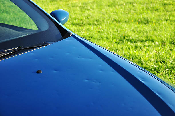 hail damage hail damage on the hood of a blue car damaged stock pictures, royalty-free photos & images