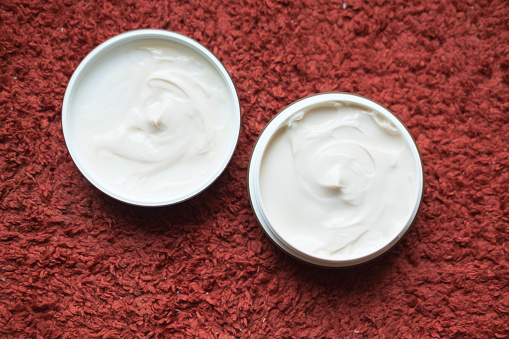 Hair Wax And Clay In Tubs On Red Background Stock Photo Download