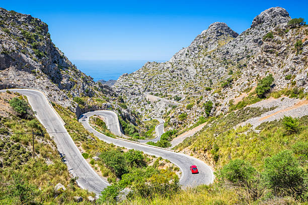 Hairpin turns to Sa Calobra - Serra de Tramuntana Hairpin turns to Sa Calobra - Serra de Tramuntana mountain range in the north-west of majorca high country stock pictures, royalty-free photos & images