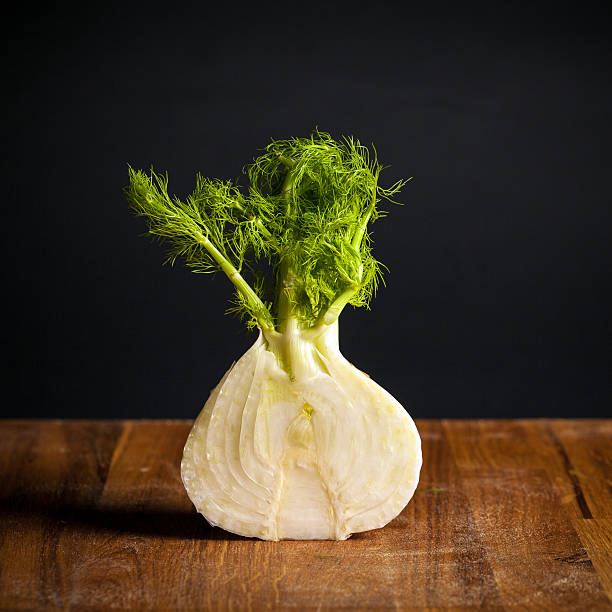 Half Fennel On Wooden Table stock photo