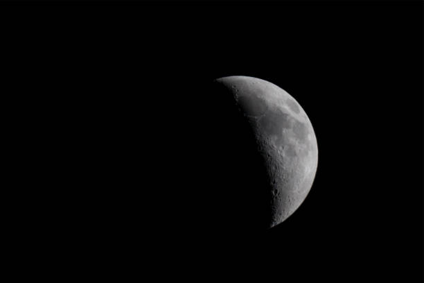 Half moon at night, isolated on black stock photo