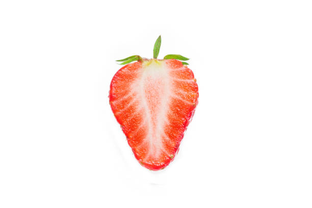 Half of strawberry isolated on white stock photo