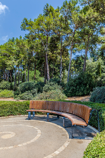 Half Round Bench In The Park Vertical Stock Photo Download Image