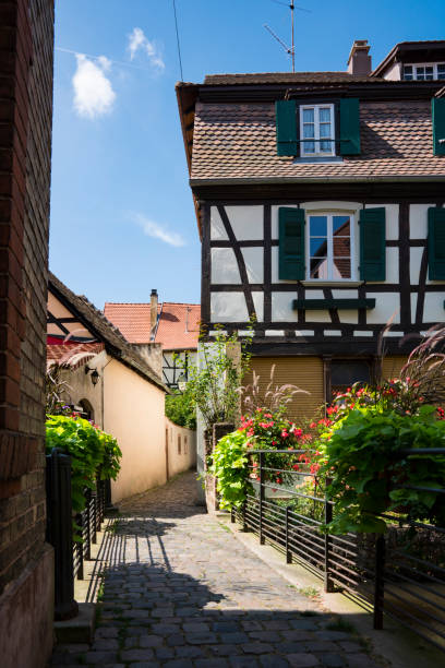 Half timbered house with shutters in alley Wissembourg, France traditional house with wooden frame, Wissembourg, France bas rhin stock pictures, royalty-free photos & images