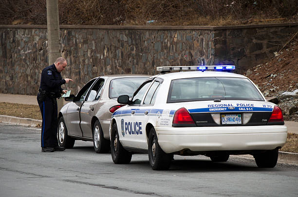 Halifax Police Officer giving motorist a ticket stock photo