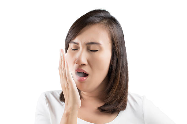 Halitosis Yawning tired woman bad breath stock pictures, royalty-free photos & images
