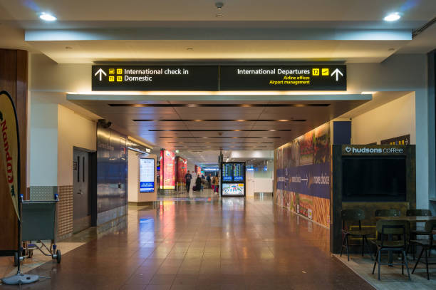 Hall and walkway in Melbourne airport with navigation boards stock photo