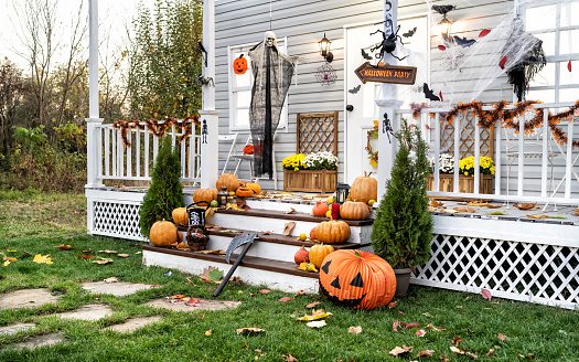 Halloween Jack-o-Lantern Pumpkins on a porch stairs