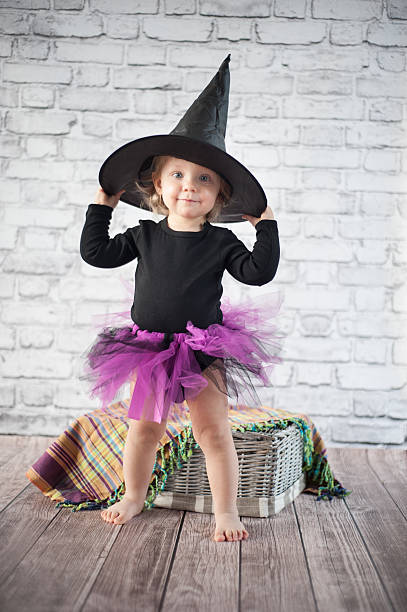 Halloween little girl witch stock photo