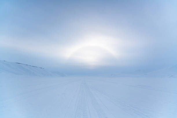 Halo effect on frosty Svalbard - ring of light visible around the svalbard sun. stock photo