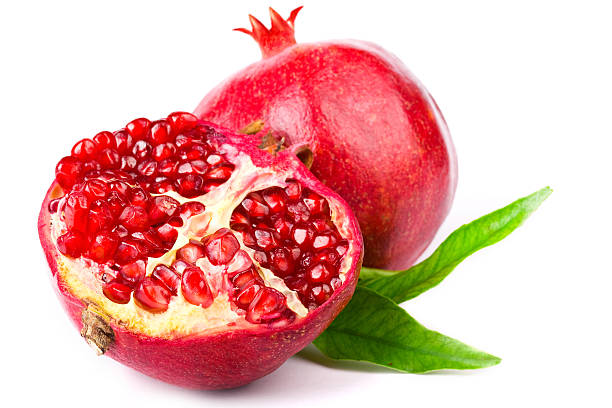 Halved pomegranate with interior view of seeds stock photo