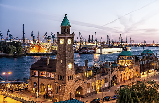 Container terminal in Hamburg, Germany. A beautiful evening sky illuminates the scene.