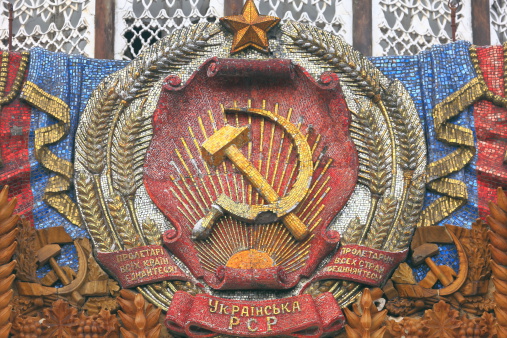 Soviet Symbol Hammer and Sickle of former Soviet Union - USSR (CCCP). Mosaic located at the VDNKh - Ukranian Pavillion. Moscow, Russia.