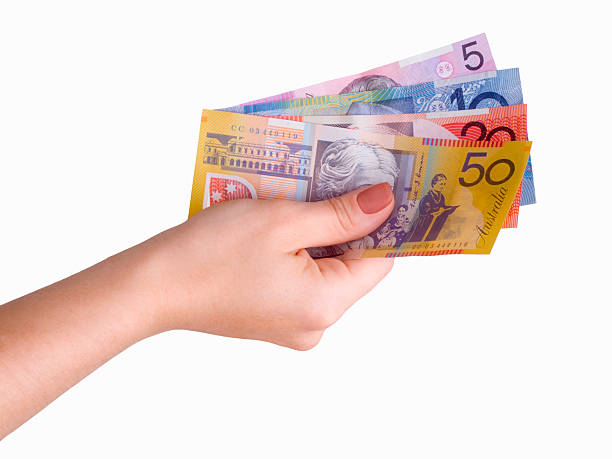 Hand and Australian Dollars stock photo