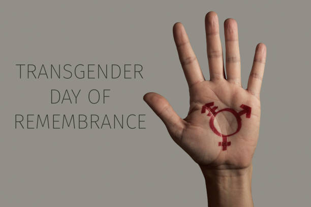 hand and text transgender day of remembrance stock photo