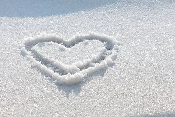 Hand drawn heart in the snow stock photo
