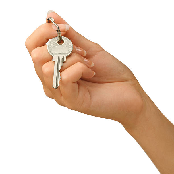 Hand giving a key stock photo
