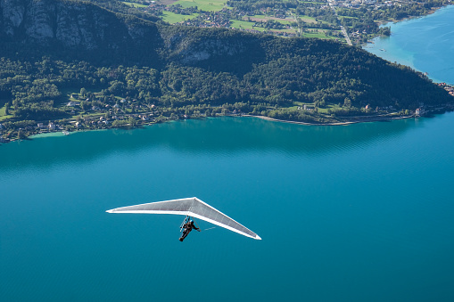 Hand gliding above Annecy's lake, France