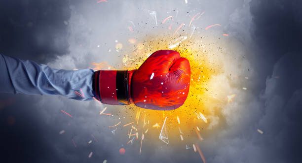 Hand hits intense and the space explodes Hand hits strongly and makes fire beam around broken suitcase stock pictures, royalty-free photos & images