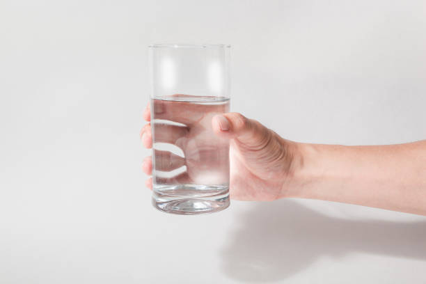 Hand Holding A Glass Of Water Stock Photos, Pictures & Royalty ...