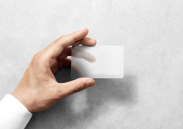 Hand hold blank translucent card mockup with rounded corners Hand hold blank translucent card mockup with rounded corners. Plain clear call-card mock up template holding arm. Plastic transparent acrylic namecard display front. human arm stock pictures, royalty-free photos & images