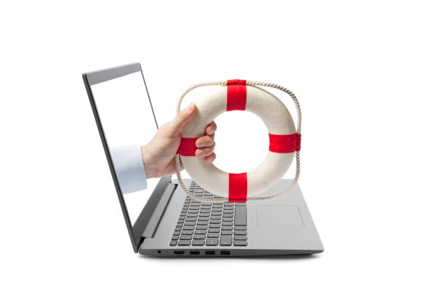 Hand holding a lifebuoy out of a laptop screen isolated on white stock photo