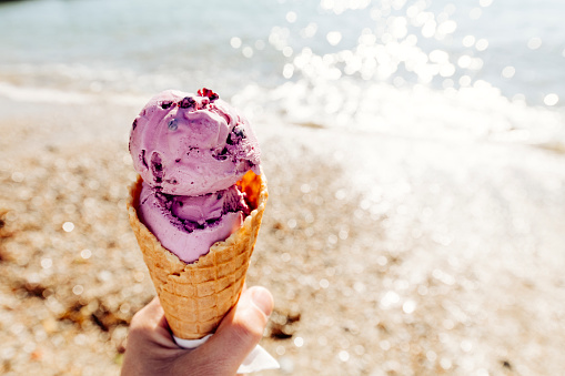 Pov Of Hand Holding A Purple Blueberry Flavoured Ice Cream ...