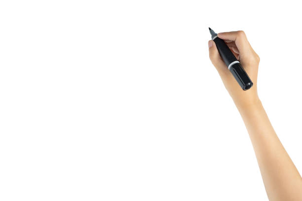 hand holding black magic marker pen ready to writing something isolated on white background with copy space, studio shot stock photo