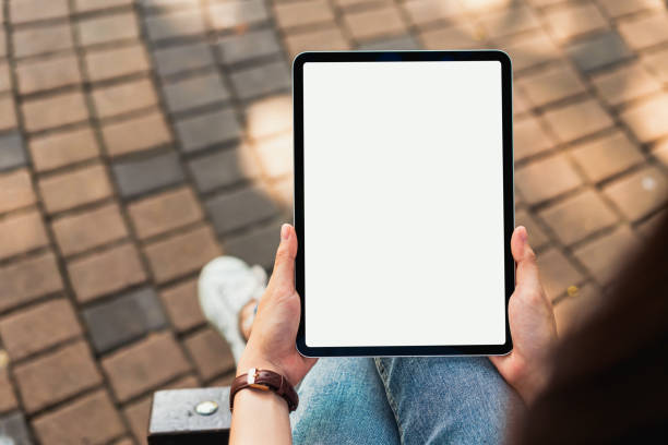 Hand holding digital tablet blank screen. mockup to screen to put products on advertising. stock photo