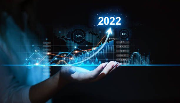 Hand holding increase arrow graph corporate future growth in year 2022. New Goals, Plans and Visions for Next Year 2022. Planning,opportunity, challenge and business strategy. stock photo