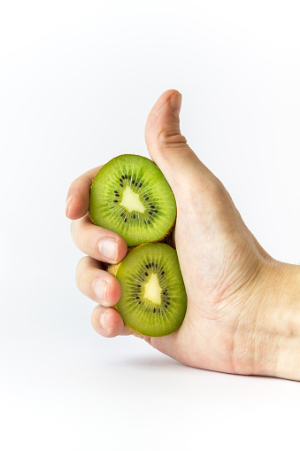 Hand Holding Kiwifruit Stock Photo - Download Image Now - Backgrounds ...