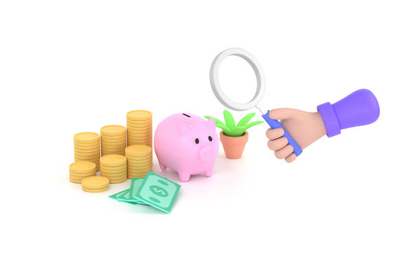 hand holding magnifying glass and Piggy bank and graduation cap collecting money for education idea stock photo