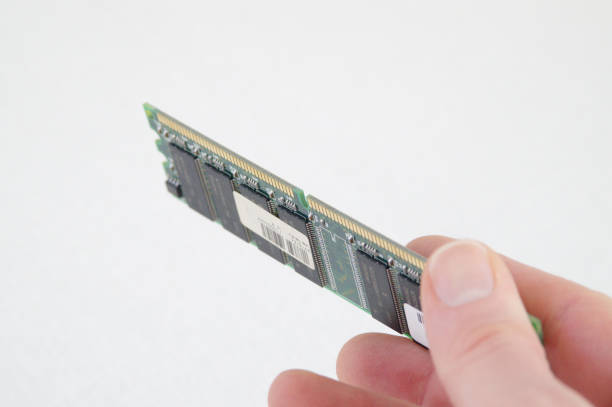 Hand holding PC RAM DIMM module stock photo