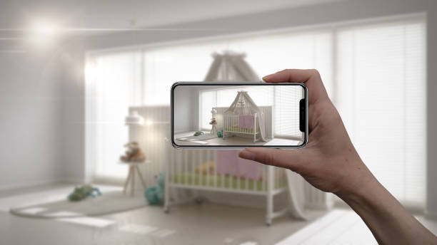 hand holding smart phone, ar application, simulate furniture and interior design products in real home, architect designer concept, blur background, white scandinavian nursery - mobile phone imagens e fotografias de stock