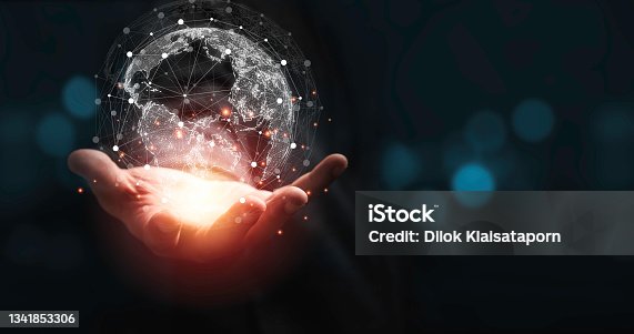 istock Hand holding virtual world with copy space and blue bokeh background for technology information and transformation concept. 1341853306