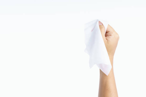 Hand holding wet wipes tissue Hand holding wet wipes tissue on white background handkerchief stock pictures, royalty-free photos & images