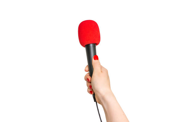 Hand of reporter with red microphone isolated on white stock photo