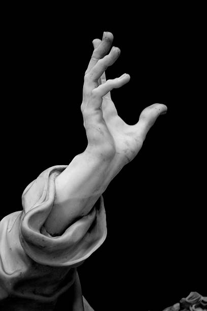Hand Detail of the Statue of Saint Peter, one of the sculptures of the Twelve Apostles inside the Basilica of St. John Lateran. Rome, Italy. Sculpture by Pierre-Étienne Monnot (1657, Orchamps-Vennes - 1733, Roma), "San Pietro", 1708-13. Black and white, grained and vignetted image. http://www.massimomerlini.it/is/vatican.jpg http://www.massimomerlini.it/is/rome.jpg http://www.massimomerlini.it/is/black&white.jpg sculpture stock pictures, royalty-free photos & images