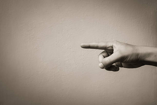 Hand pointing Hand pointing. Isolated background.  guilt stock pictures, royalty-free photos & images
