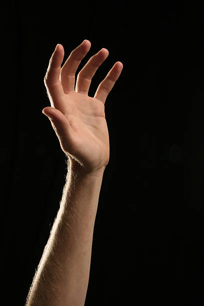 Hand Reaching Up For Help stock photo