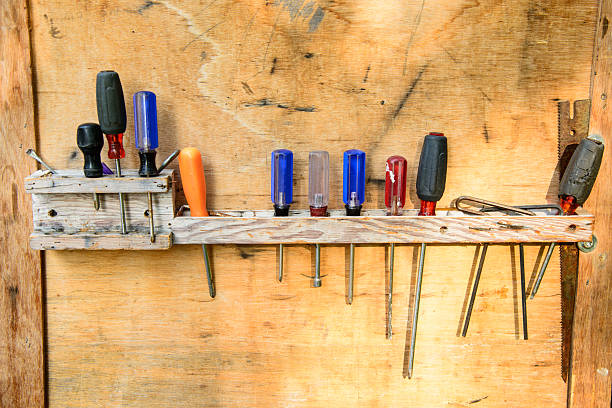 Hand tools hanging in homemade rack stock photo
