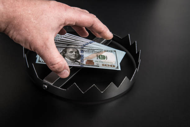 Hand trap for dollar bill, money. stock photo