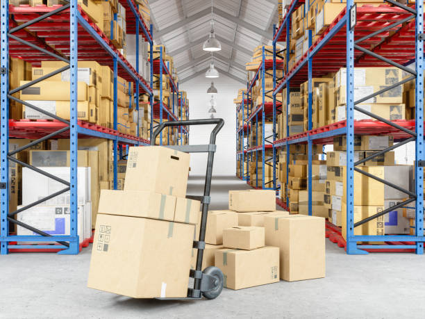 Hand truck and cardboard boxes  in warehouse Hand truck and cardboard boxes  in warehouse push cart stock pictures, royalty-free photos & images